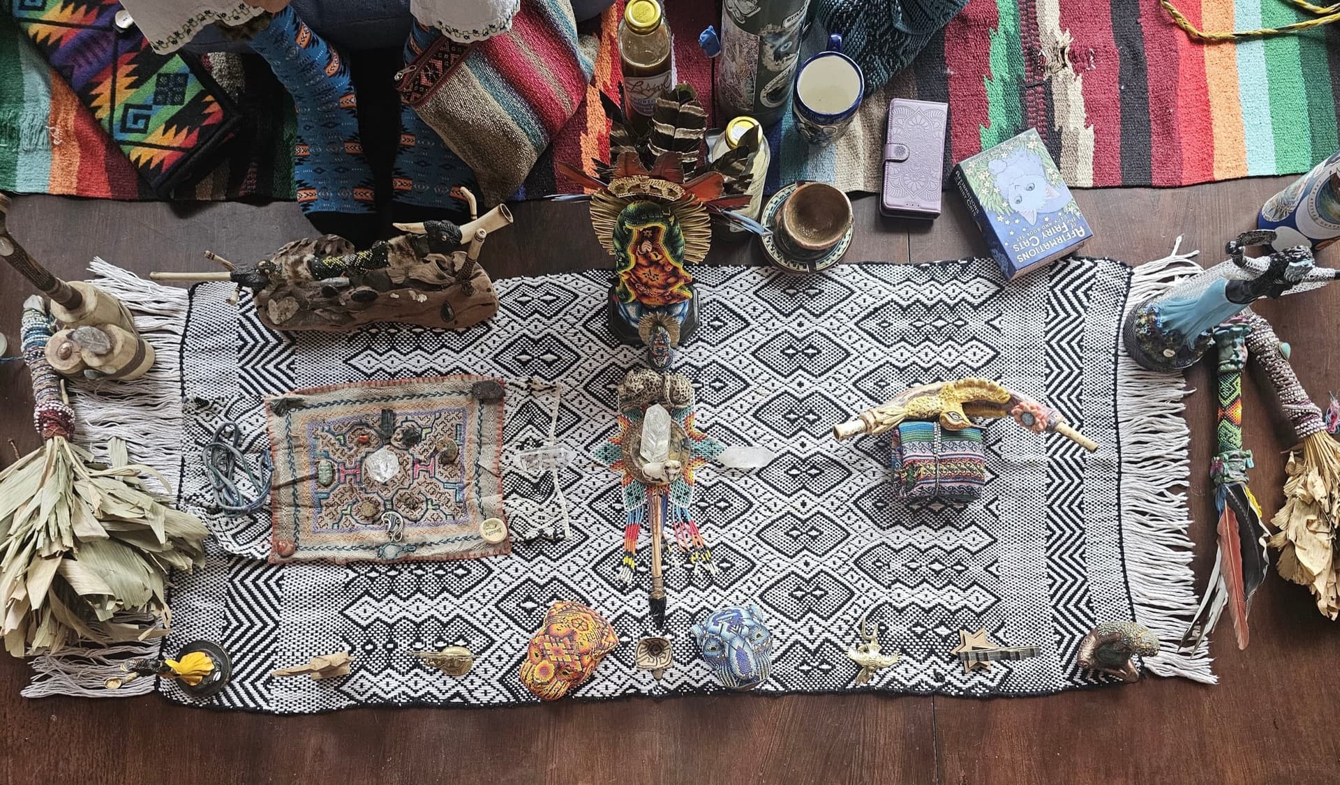Ceremonial altar with textiles, crystals, and prayer objects