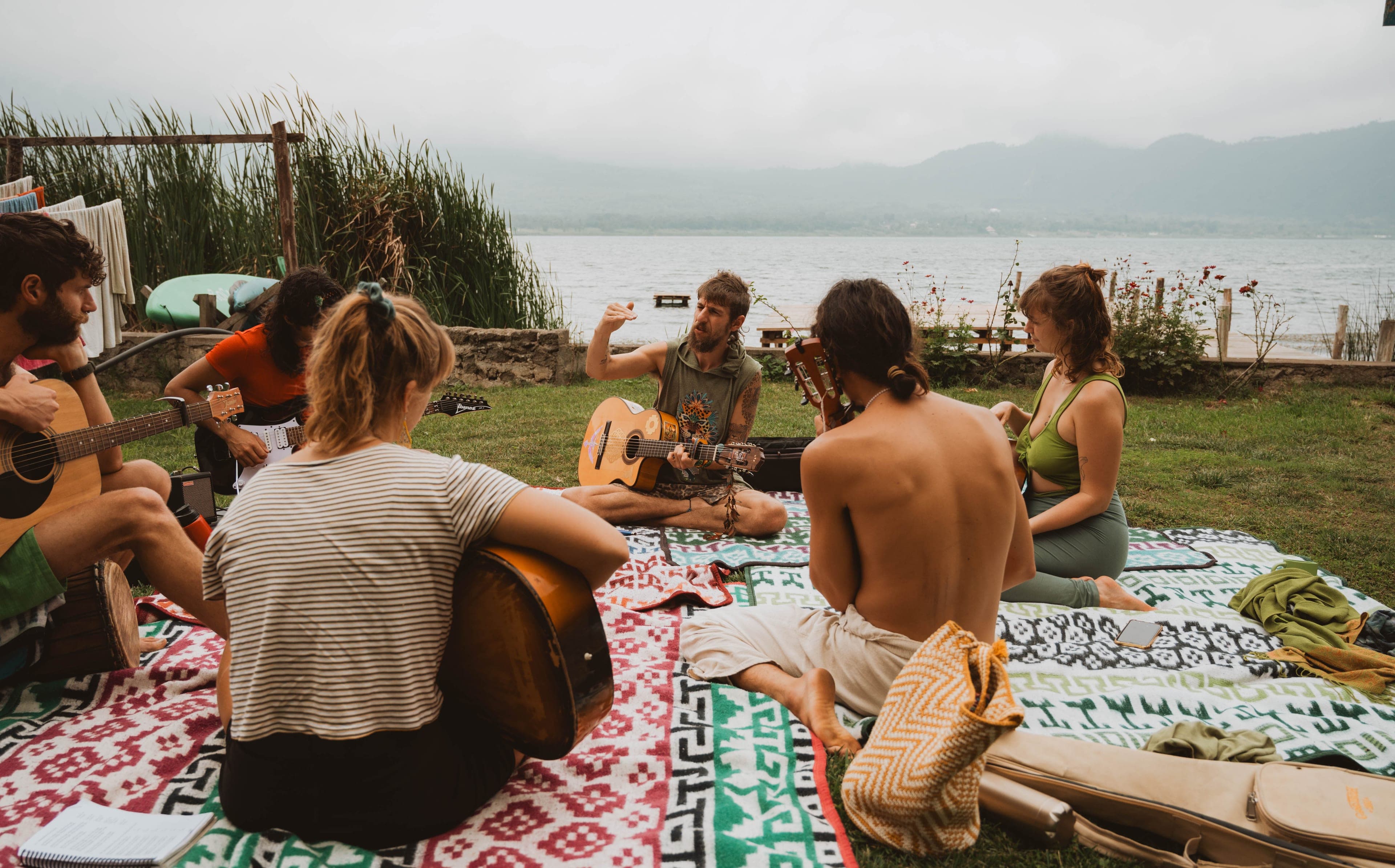 Guitar circle by the lake at Mystical Yoga Farm