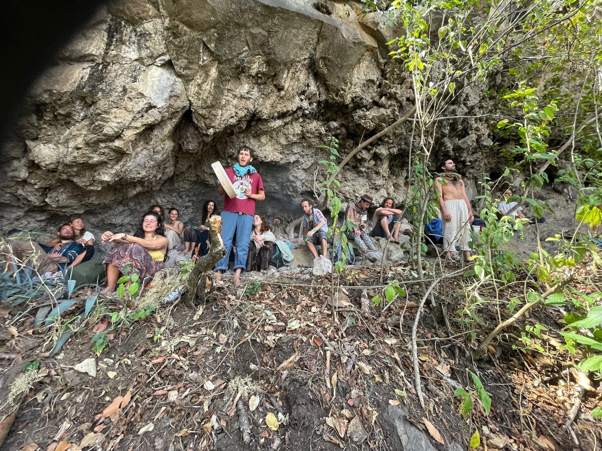 Huachuma ceremony under a rock overhang in the mountains above Lake Atitlán