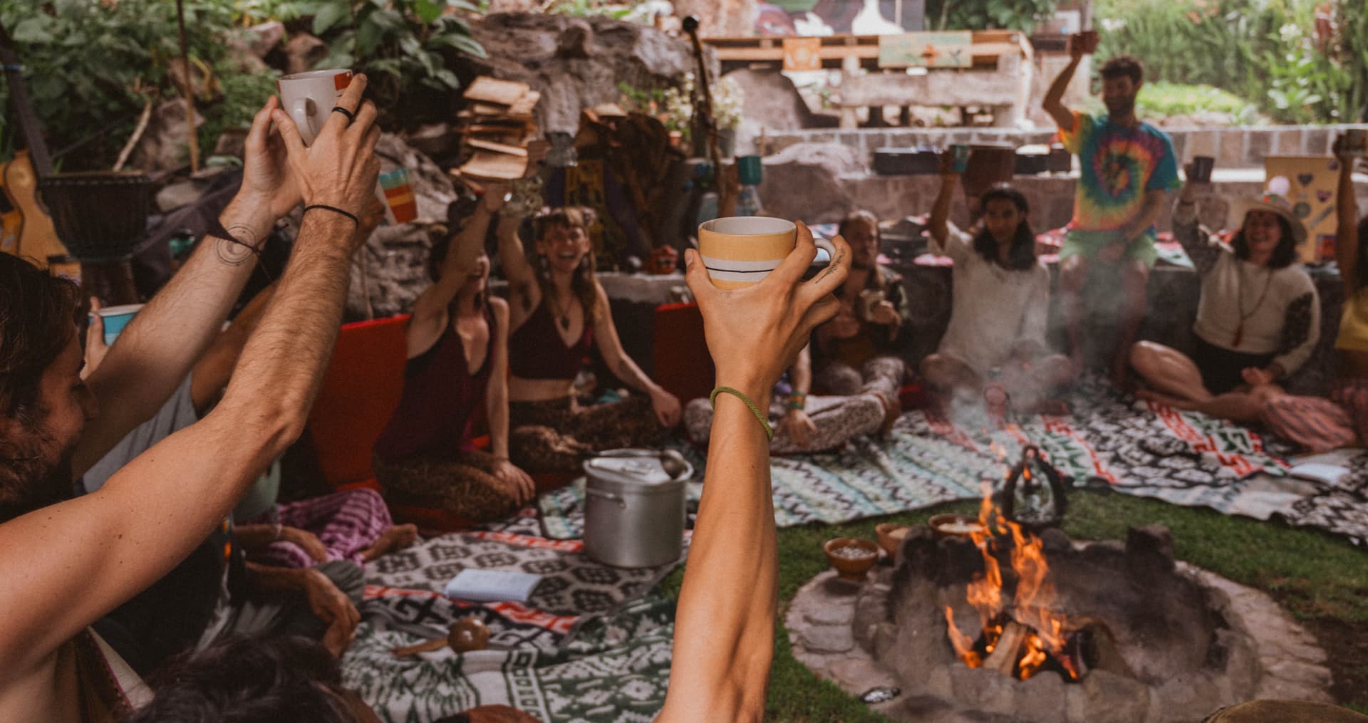 Cacao toast around the fire in circle at Mystical Yoga Farm