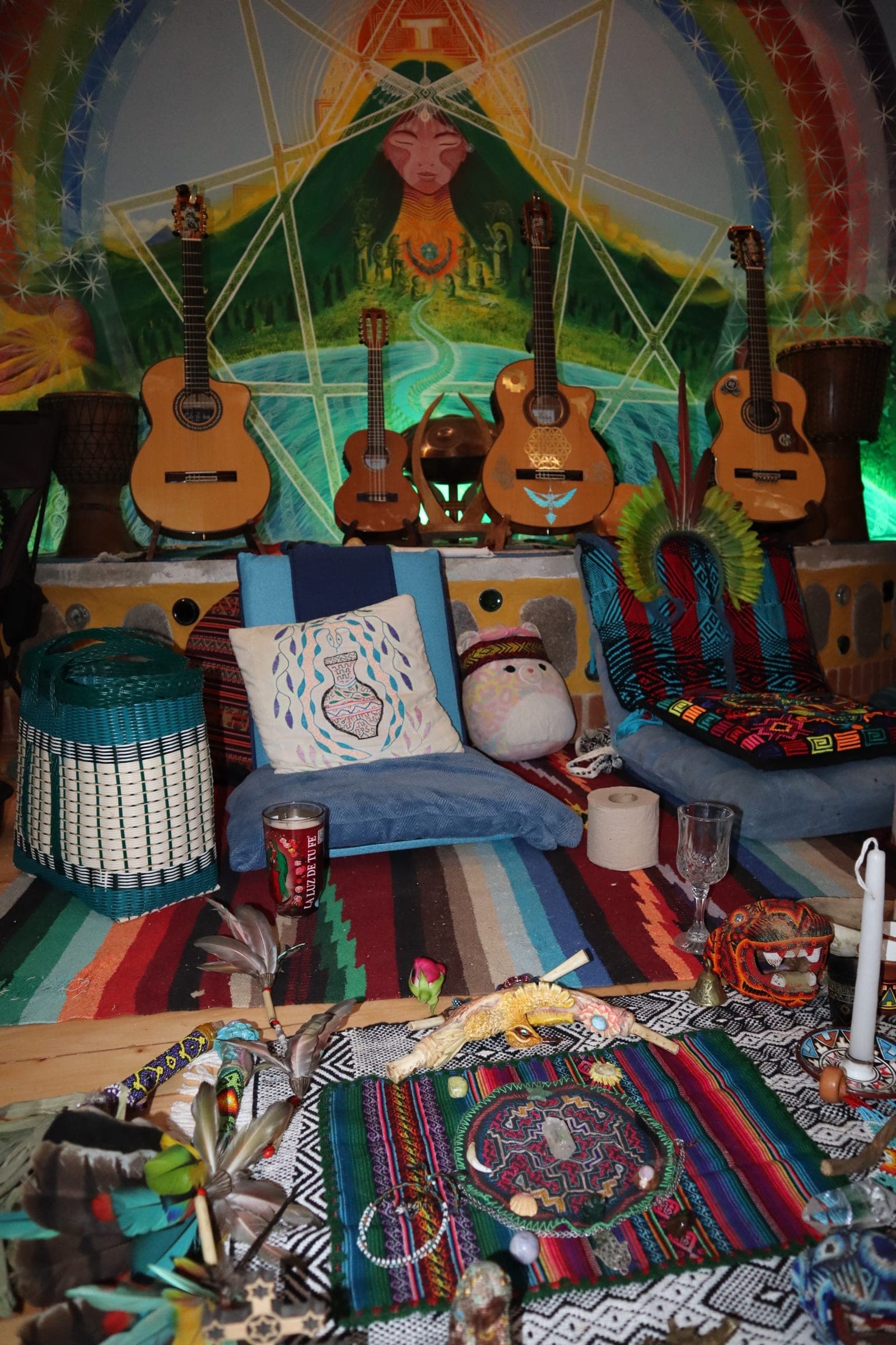 Altar, guitars, and mural inside Temple da Jiboia